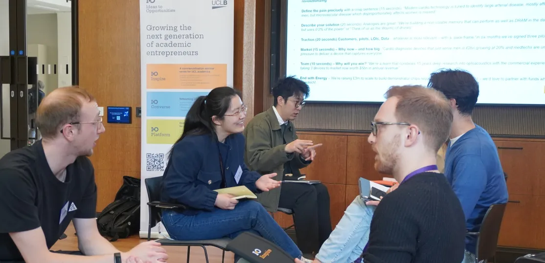 mixed group of researchers sitting and discussing at I-O Inspire 'speed dating'