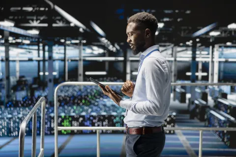 data center employee on platform works on neural network software tasks
