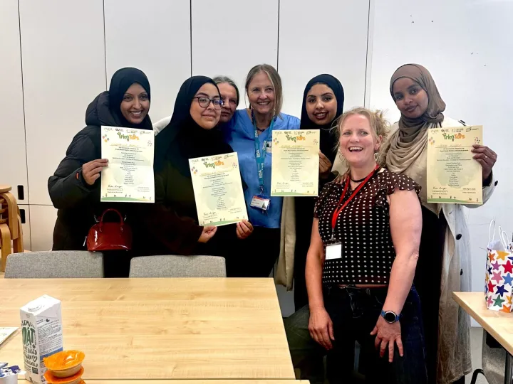 group of mothers holding up certificates from Plant Munch
