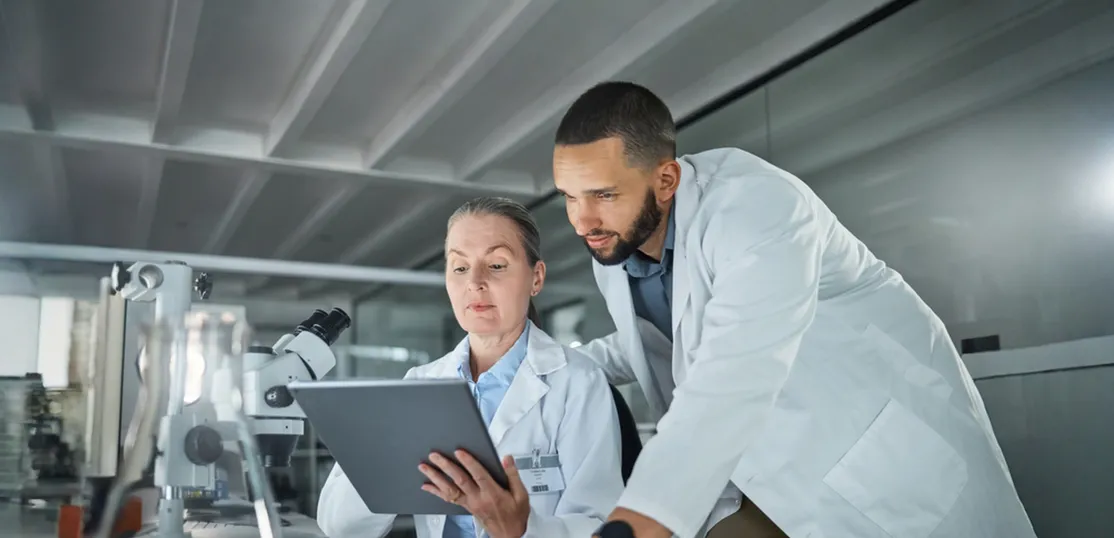 Science teamwork, tablet and scientist in digital research analysis, investigation or check medical software analytics in laboratory. Healthcare innovation biotechnology expert people reading report stock photo