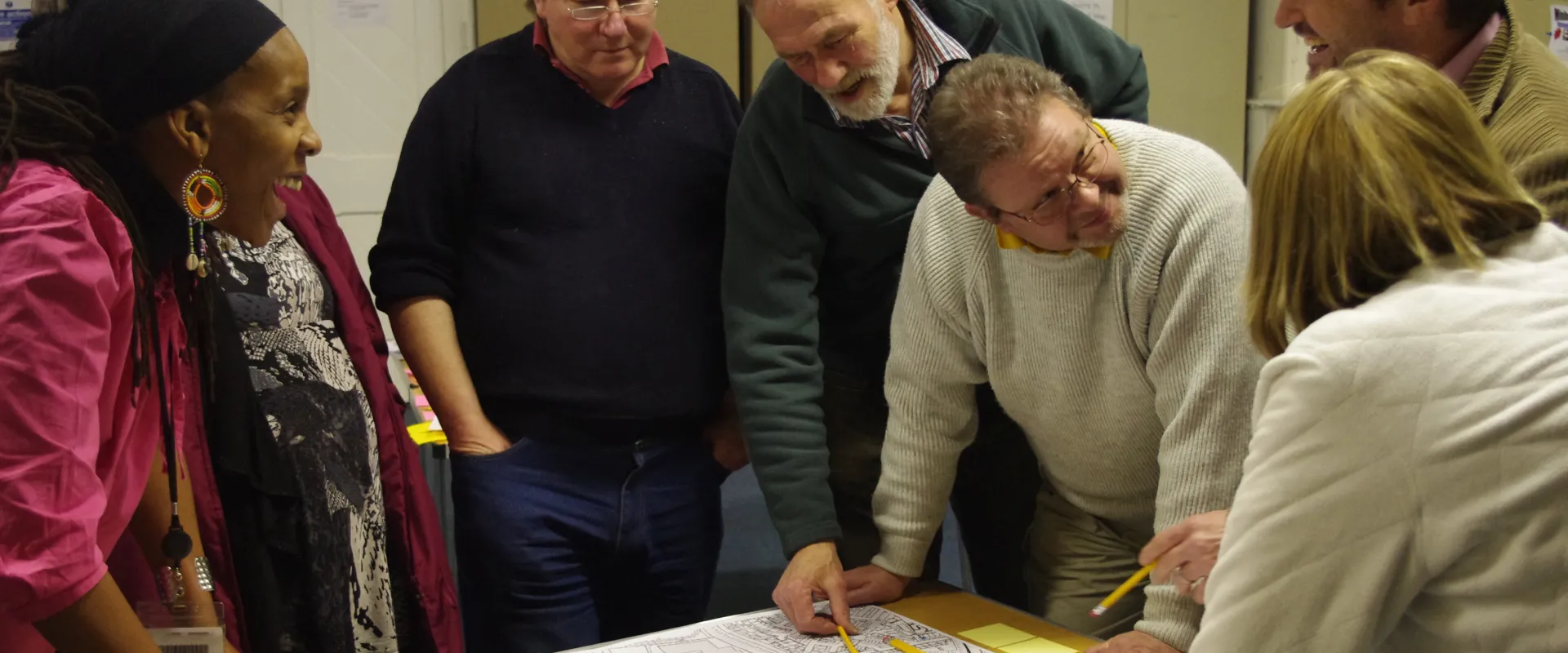 community group discussing over a map