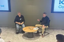 Dr Martin Pule talks to Dr Rick Fagan in front of a crowd at I-O Converse