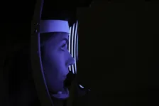 Lady taking part in an eye examination. 