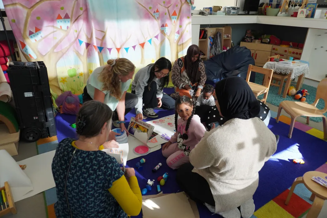 group of parents and children doing crafts with Trim Tots