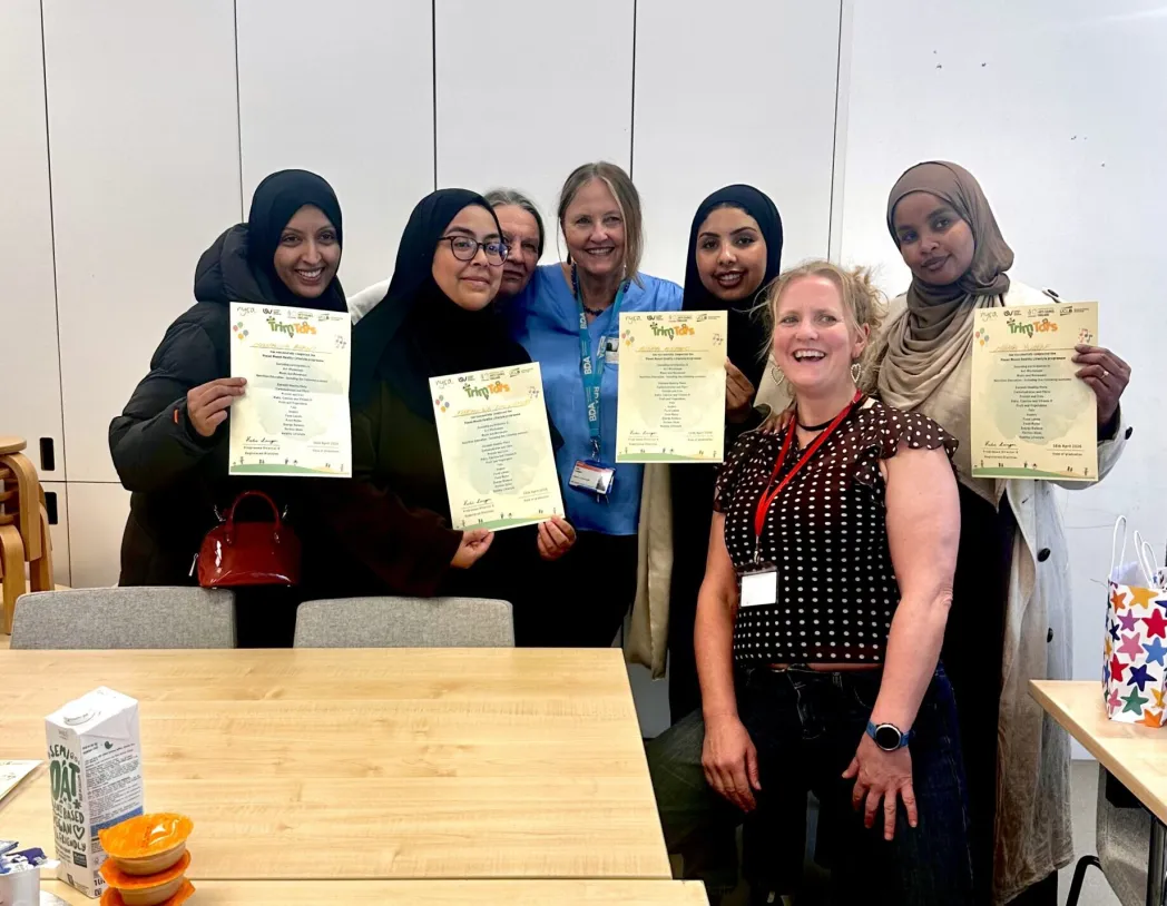 group of mothers holding up certificates from Plant Munch